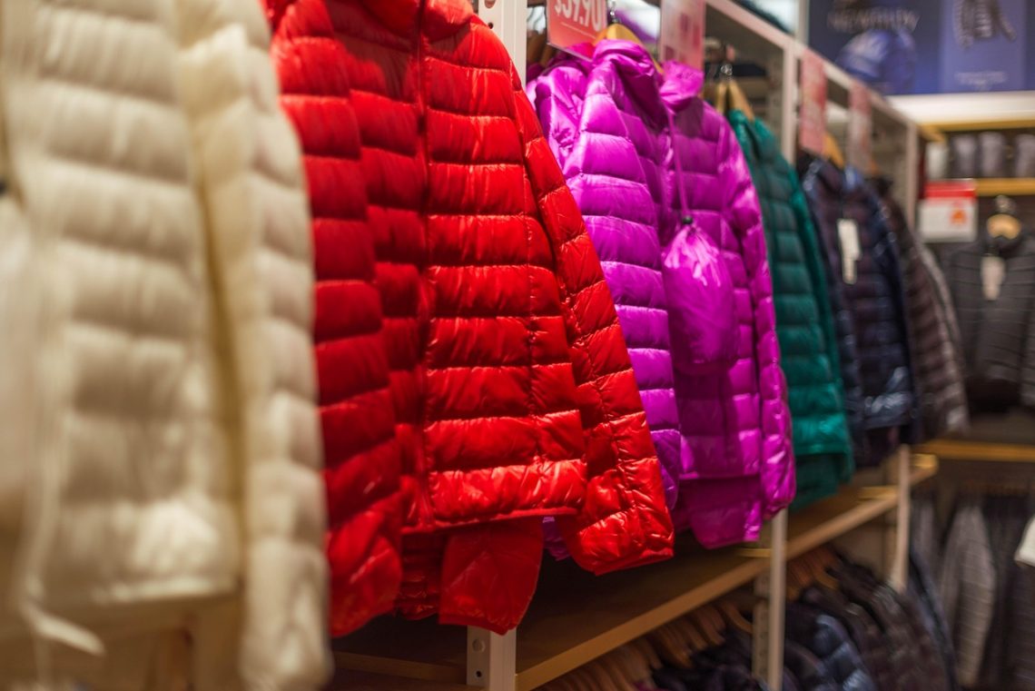 colorful down jackets displayed in a shop