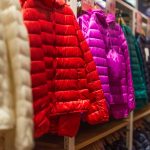 colorful down jackets displayed in a shop