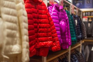 colorful down jackets displayed in a shop